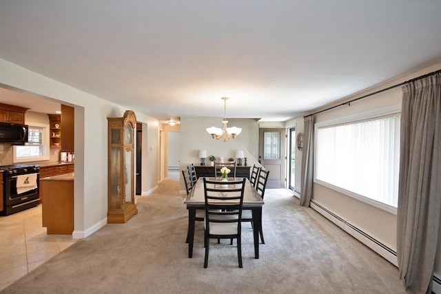 2 Short Hill Rd, New City, NY 10956 - dining room with a baseboard radiator, a chandelier, light carpet, and healthy amount of natural light