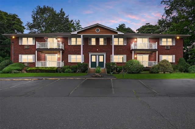 86 Demarest Ave Unit 1, West Nyack, NY 10994 - view of front of property featuring uncovered parking, brick siding, and a balcony