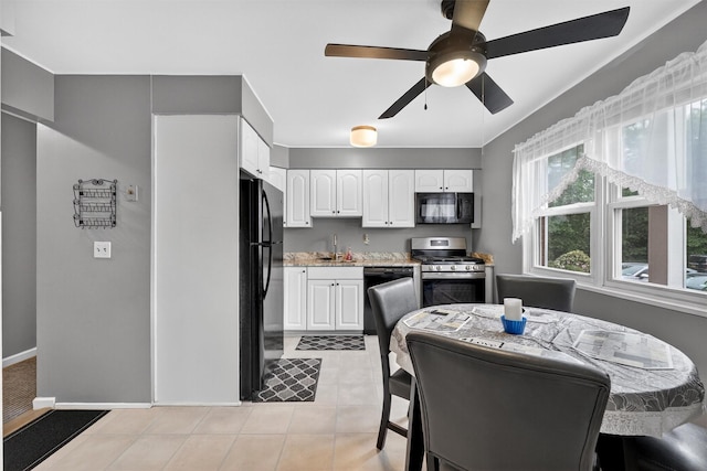 86 Demarest Ave Unit 1, West Nyack, NY 10994 - kitchen featuring black appliances, white cabinets, ceiling fan, light tile patterned floors, and light stone countertops