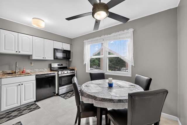 86 Demarest Ave Unit 1, West Nyack, NY 10994 - kitchen featuring black appliances, white cabinetry, a ceiling fan, and light stone countertops