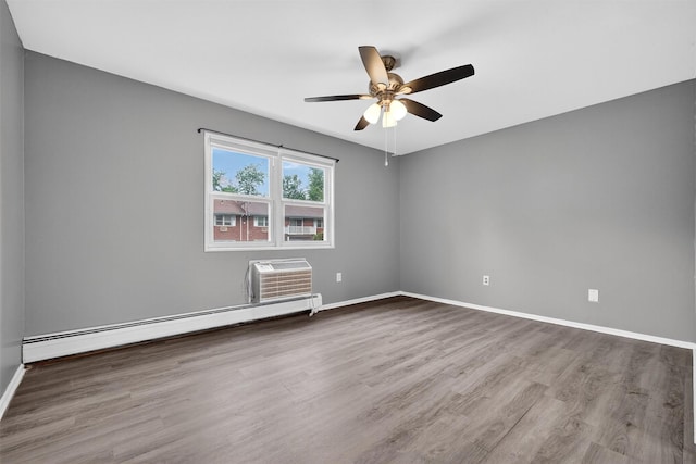 86 Demarest Ave Unit 1, West Nyack, NY 10994 - unfurnished room with a baseboard heating unit, a wall mounted AC, wood finished floors, and a ceiling fan
