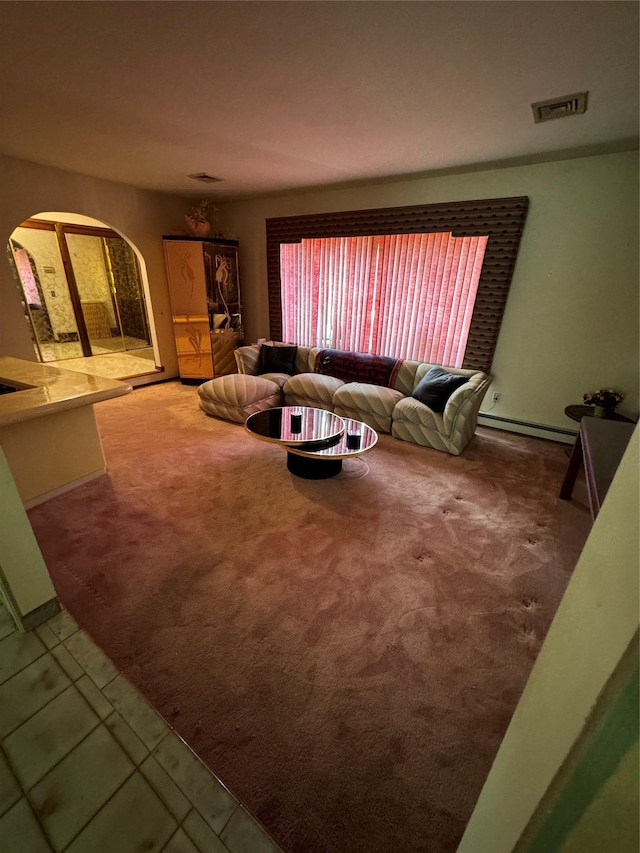 28 Jansen St, Staten Island, NY 10312 - tiled living area featuring arched walkways, carpet floors, and baseboard heating