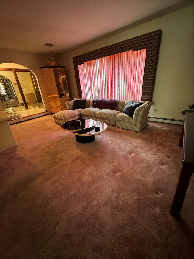 28 Jansen St, Staten Island, NY 10312 - living area featuring arched walkways, baseboard heating, and carpet