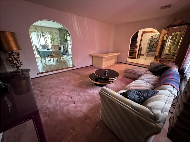 28 Jansen St, Staten Island, NY 10312 - living area featuring arched walkways, carpet floors, and a chandelier