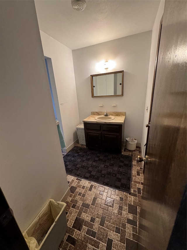 28 Jansen St, Staten Island, NY 10312 - bathroom featuring vanity and brick patterned flooring