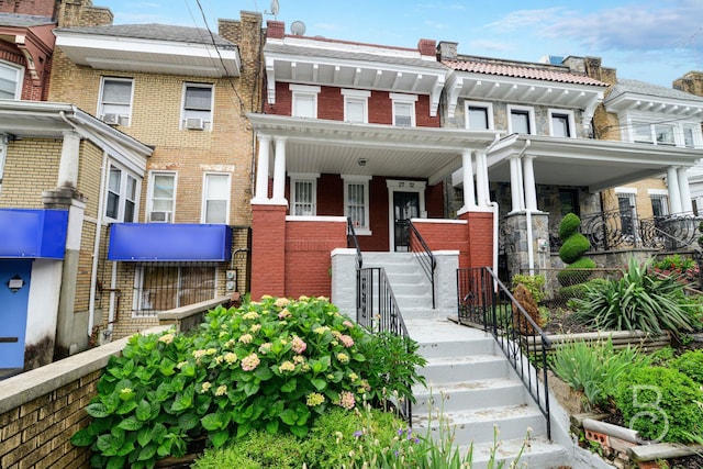 27-12 Ditmars Blvd, Astoria, NY 11105 - multi unit property featuring brick siding, covered porch, and cooling unit
