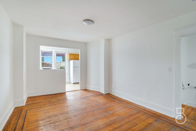 27-12 Ditmars Blvd, Astoria, NY 11105 - unfurnished room featuring wood-type flooring