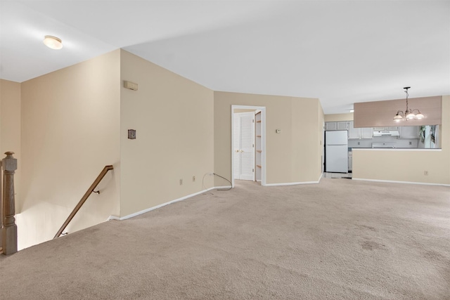 307 Gazebo Ct, New Windsor, NY 12553 - unfurnished living room featuring a chandelier and light carpet