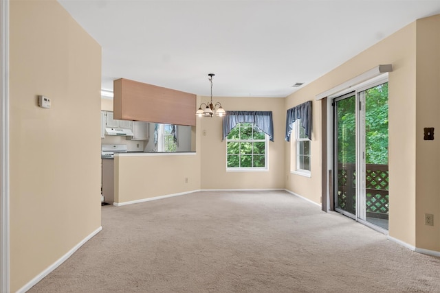307 Gazebo Ct, New Windsor, NY 12553 - empty room featuring a chandelier, light colored carpet, and plenty of natural light