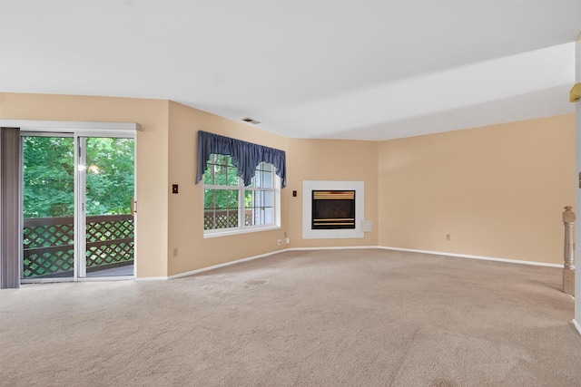 307 Gazebo Ct, New Windsor, NY 12553 - unfurnished living room with carpet and a glass covered fireplace