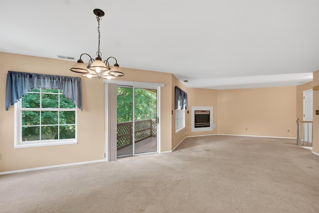 307 Gazebo Ct, New Windsor, NY 12553 - unfurnished living room featuring a chandelier, carpet, and a fireplace