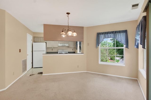 307 Gazebo Ct, New Windsor, NY 12553 - kitchen featuring freestanding refrigerator, stove, a chandelier, light colored carpet, and decorative light fixtures