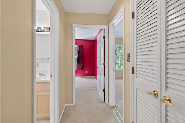 307 Gazebo Ct, New Windsor, NY 12553 - hall featuring light colored carpet and a sink