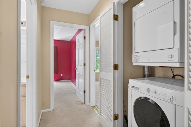 307 Gazebo Ct, New Windsor, NY 12553 - laundry area with stacked washer / drying machine and light carpet