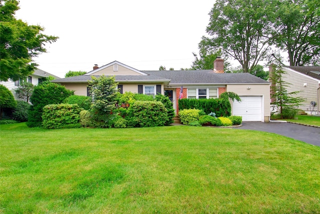 59 Russell Rd, Garden City, NY 11530 - single story home featuring a garage, a front lawn, and driveway