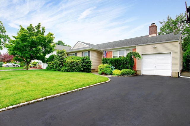 59 Russell Rd, Garden City, NY 11530 - single story home featuring an attached garage, a front lawn, a chimney, and asphalt driveway