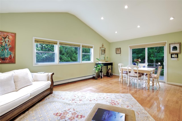 59 Russell Rd, Garden City, NY 11530 - living area with baseboard heating, light wood-style floors, recessed lighting, and high vaulted ceiling