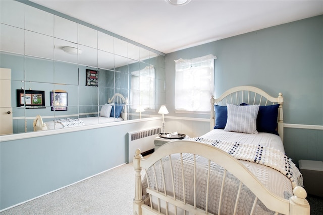 59 Russell Rd, Garden City, NY 11530 - bedroom with radiator heating unit and carpet floors