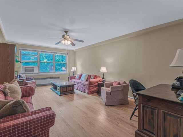 811 Palmer Rd Unit 2A, Bronxville, NY 10708 - living room with radiator heating unit, ceiling fan, light wood-style floors, cooling unit, and ornamental molding