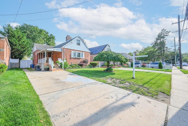 202 Roosevelt Ave, Valley Stream, NY 11581 - bungalow featuring driveway, brick siding, a chimney, and covered porch