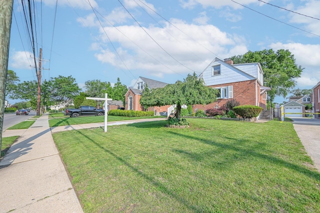 202 Roosevelt Ave, Valley Stream, NY 11581 - view of front of house featuring brick siding, a front yard, and a chimney