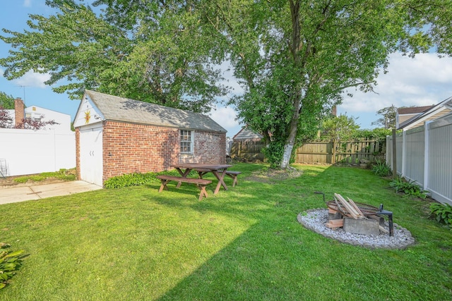 202 Roosevelt Ave, Valley Stream, NY 11581 - fenced backyard featuring an outdoor structure, an outdoor fire pit, and a garage