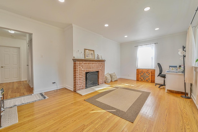 202 Roosevelt Ave, Valley Stream, NY 11581 - living room with wood finished floors, crown molding, a desk, a brick fireplace, and recessed lighting