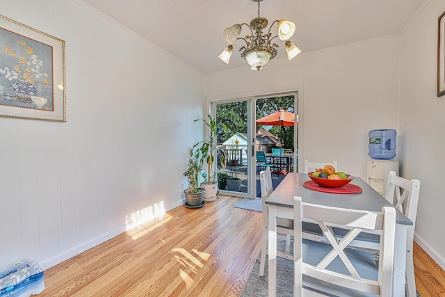202 Roosevelt Ave, Valley Stream, NY 11581 - dining room featuring a chandelier, light wood finished floors, and crown molding