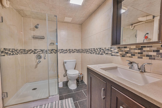 202 Roosevelt Ave, Valley Stream, NY 11581 - bathroom featuring tile walls, a shower stall, vanity, and tile patterned flooring