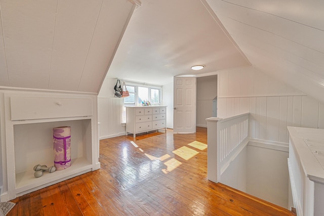 202 Roosevelt Ave, Valley Stream, NY 11581 - bonus room featuring wood-type flooring, lofted ceiling, and a decorative wall