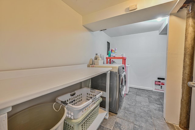 202 Roosevelt Ave, Valley Stream, NY 11581 - laundry room featuring washing machine and clothes dryer and stone finish floors