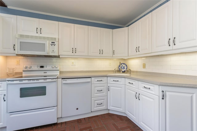 509 Hudson View Rd, Nyack, NY 10960 - kitchen with white appliances, light countertops, brick patterned flooring, white cabinets, and tasteful backsplash