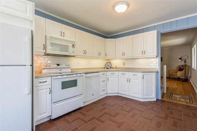 509 Hudson View Rd, Nyack, NY 10960 - kitchen featuring white appliances, light countertops, white cabinetry, decorative backsplash, and ornamental molding