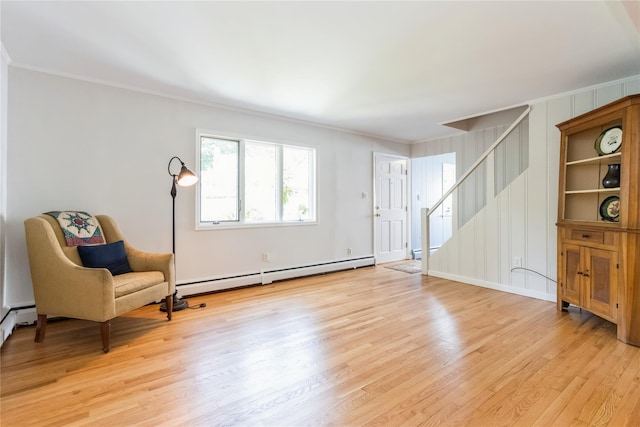 509 Hudson View Rd, Nyack, NY 10960 - living area with a baseboard radiator, crown molding, stairs, light wood-type flooring, and a baseboard heating unit
