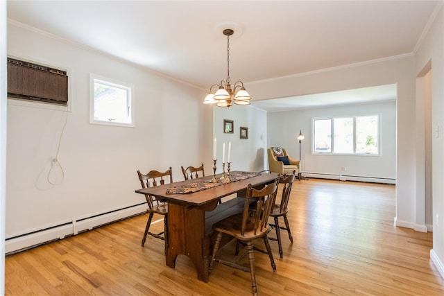 509 Hudson View Rd, Nyack, NY 10960 - dining area with a baseboard radiator, plenty of natural light, a chandelier, and ornamental molding
