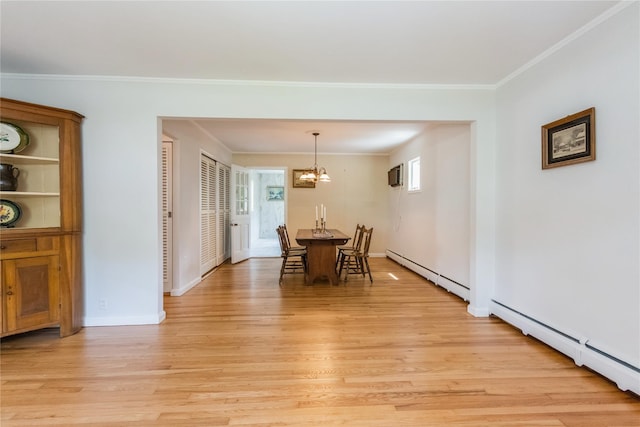 509 Hudson View Rd, Nyack, NY 10960 - dining space featuring a baseboard heating unit, light wood-style floors, a chandelier, ornamental molding, and a wall mounted air conditioner