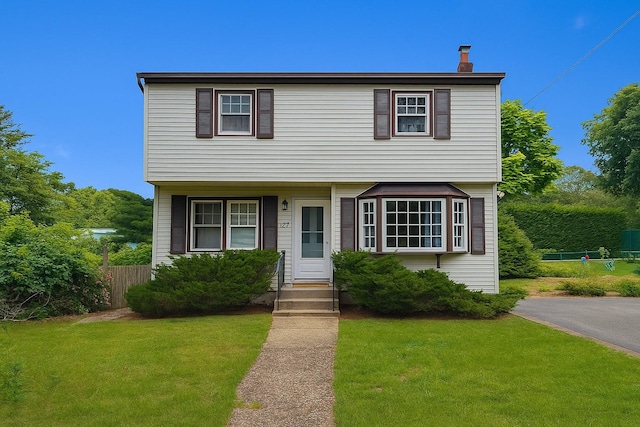 187 Horseblock Rd, Farmingville, NY 11738 - colonial home featuring a chimney