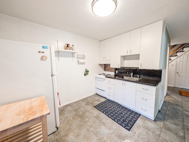 187 Horseblock Rd, Farmingville, NY 11738 - kitchen with white appliances, tasteful backsplash, dark countertops, open shelves, and white cabinetry