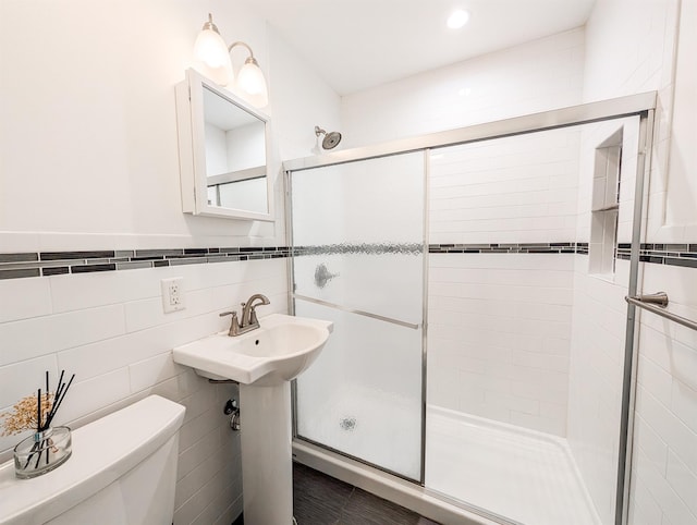 187 Horseblock Rd, Farmingville, NY 11738 - full bathroom featuring a stall shower and tile walls