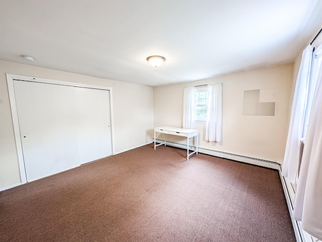 187 Horseblock Rd, Farmingville, NY 11738 - unfurnished bedroom featuring carpet floors, a baseboard heating unit, a baseboard radiator, and a closet