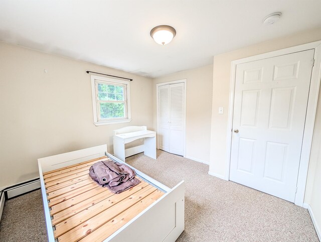 187 Horseblock Rd, Farmingville, NY 11738 - carpeted bedroom featuring a closet and baseboards