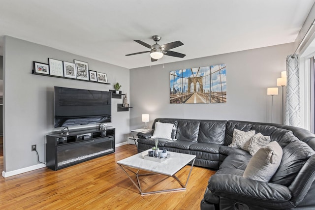 10 Elm Ave, Smithtown, NY 11787 - living room with wood finished floors, ceiling fan, and healthy amount of natural light