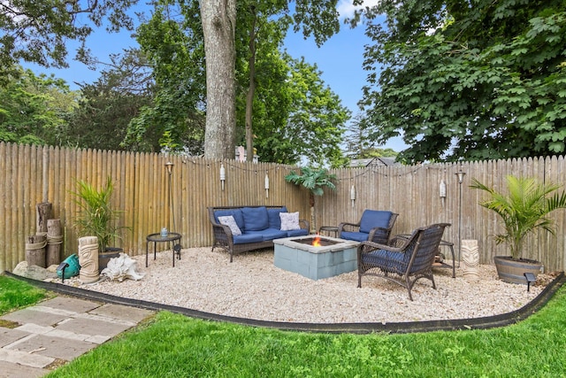 10 Elm Ave, Smithtown, NY 11787 - fenced backyard featuring an outdoor living space with a fire pit