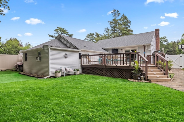 10 Elm Ave, Smithtown, NY 11787 - rear view of house featuring a wooden deck, a fenced backyard, a gate, and roof with shingles