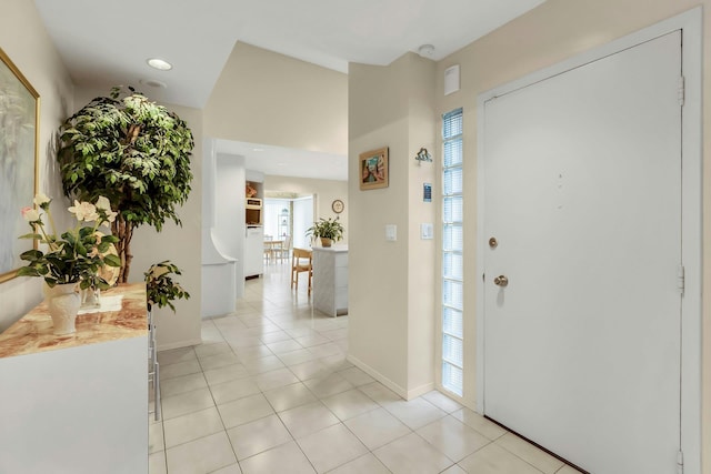102 Bayview Ave, East Islip, NY 11730 - foyer with baseboards and light tile patterned floors