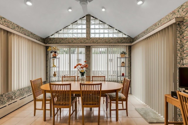 102 Bayview Ave, East Islip, NY 11730 - dining space featuring a baseboard radiator, wallpapered walls, vaulted ceiling, and light tile patterned flooring