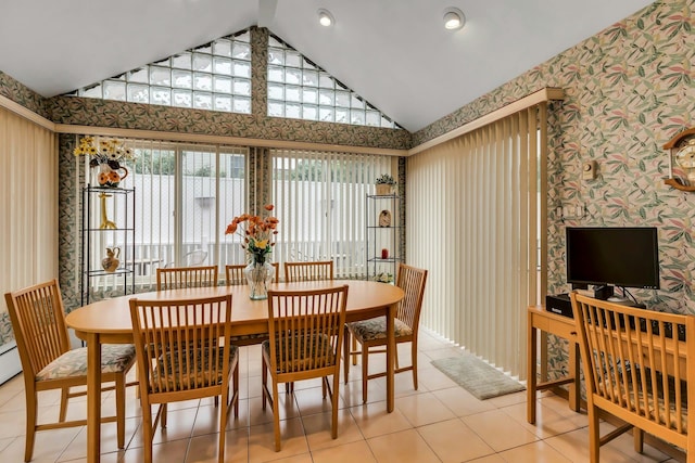 102 Bayview Ave, East Islip, NY 11730 - dining room with wallpapered walls, tile patterned floors, and high vaulted ceiling