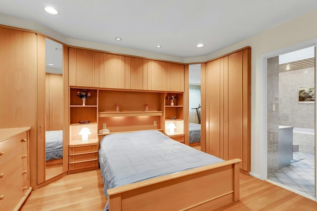 102 Bayview Ave, East Islip, NY 11730 - bedroom with light wood-style flooring, recessed lighting, and ensuite bathroom