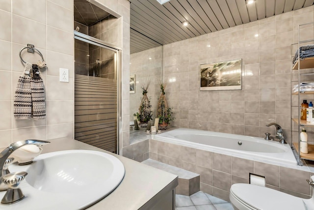 102 Bayview Ave, East Islip, NY 11730 - full bath with tile walls, a bath, vanity, a tile shower, and tile patterned floors