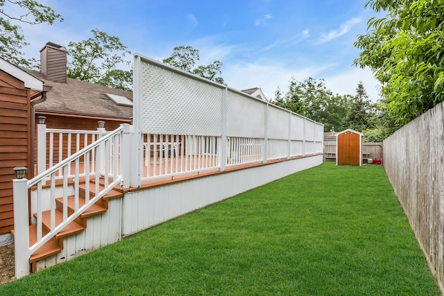 102 Bayview Ave, East Islip, NY 11730 - fenced backyard with a deck, a storage shed, and stairs